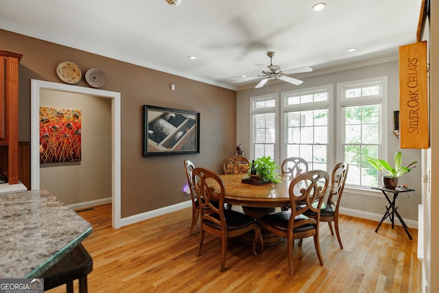 dining room with ceiling fan, recessed lighting, baseboards, ornamental molding, and light wood finished floors