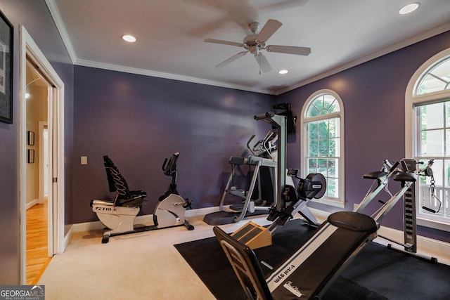 exercise room with carpet floors, crown molding, recessed lighting, ceiling fan, and baseboards