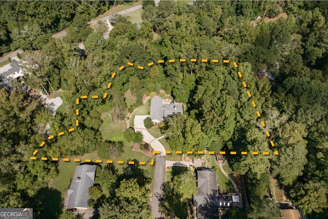 aerial view featuring a view of trees