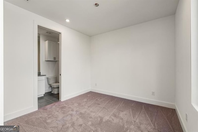 241 Maynard Ter SE Unit 15, Atlanta, GA 30316 - unfurnished bedroom with ensuite bath, recessed lighting, carpet flooring, and baseboards