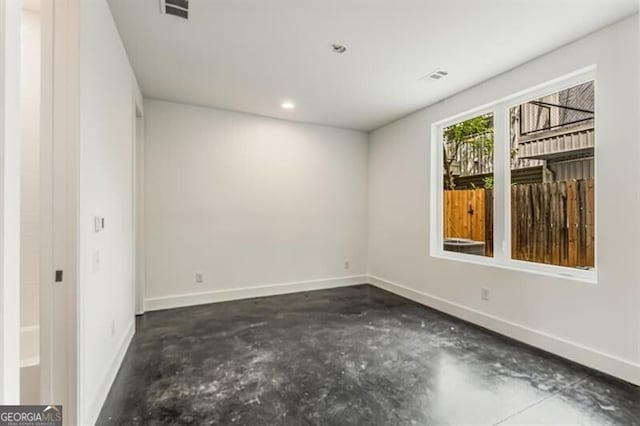 241 Maynard Ter SE Unit 15, Atlanta, GA 30316 - unfurnished room with baseboards, unfinished concrete floors, visible vents, and recessed lighting