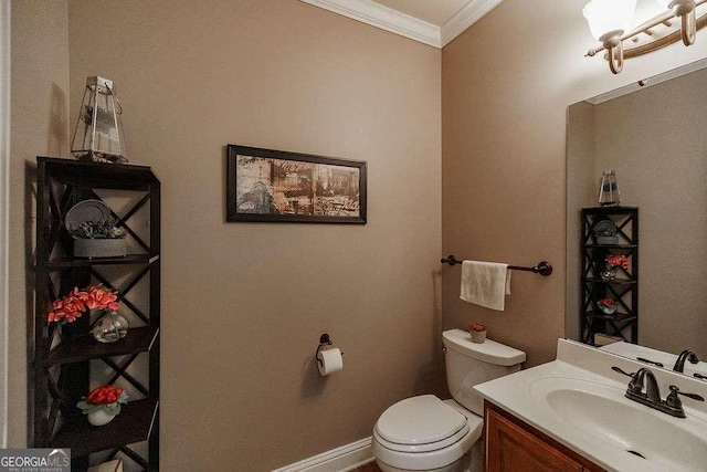 half bath featuring toilet, baseboards, crown molding, and vanity