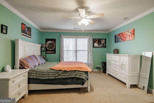 bedroom with visible vents, ornamental molding, a ceiling fan, and light colored carpet