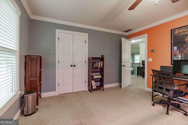 office with ornamental molding, light carpet, and baseboards