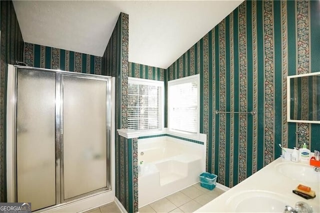 bathroom featuring a stall shower, tile patterned flooring, a bath, and wallpapered walls