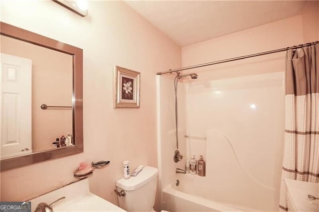 full bath featuring toilet and shower / bath combination with curtain