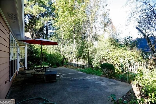 view of patio / terrace featuring fence