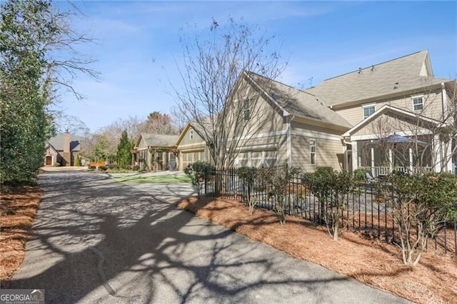 view of property exterior with fence