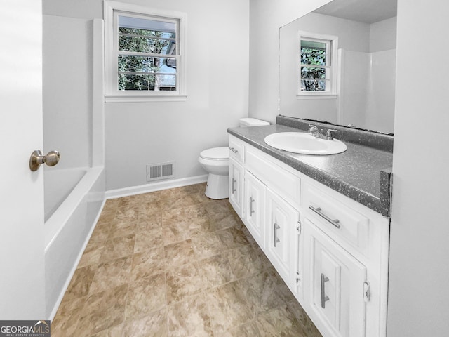 bathroom with baseboards, visible vents, vanity, and toilet