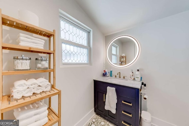 bathroom featuring vanity and baseboards