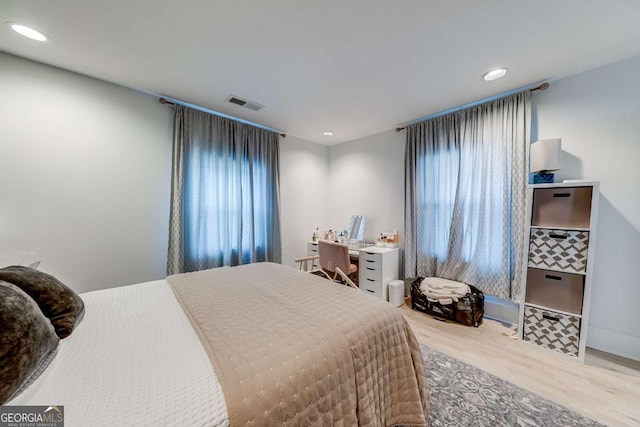 bedroom featuring visible vents, wood finished floors, and recessed lighting