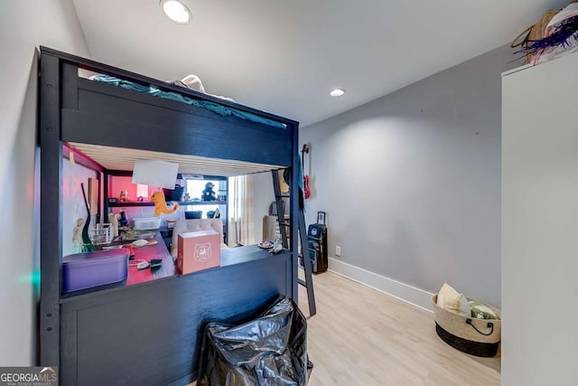 bedroom with recessed lighting, baseboards, and wood finished floors