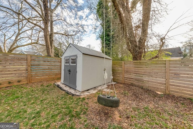 view of shed with a fenced backyard