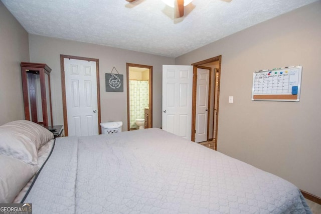 bedroom with connected bathroom, a ceiling fan, and a textured ceiling