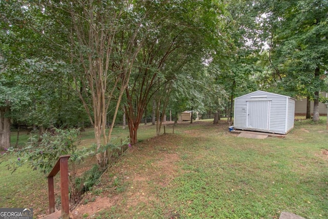 view of yard with an outbuilding and a storage shed