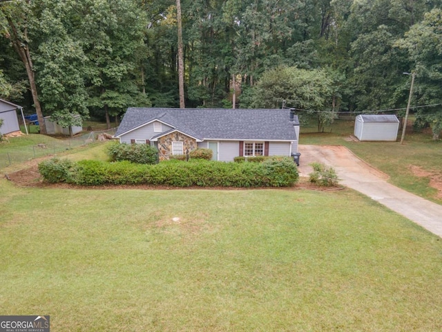 ranch-style house featuring an outbuilding, stone siding, and a front lawn