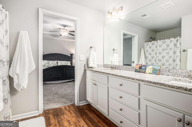 full bath featuring double vanity, a sink, and visible vents