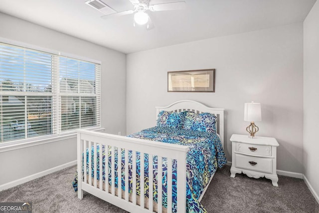 bedroom with carpet floors, visible vents, baseboards, and ceiling fan