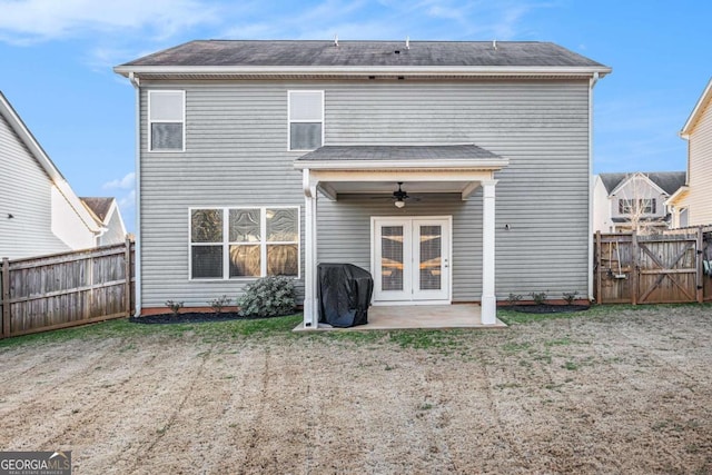 back of property featuring a fenced backyard, a ceiling fan, french doors, a gate, and a patio area