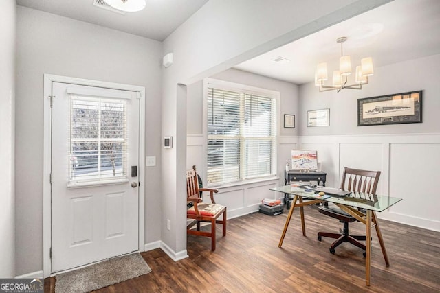 office with wainscoting, a chandelier, dark wood finished floors, and a decorative wall