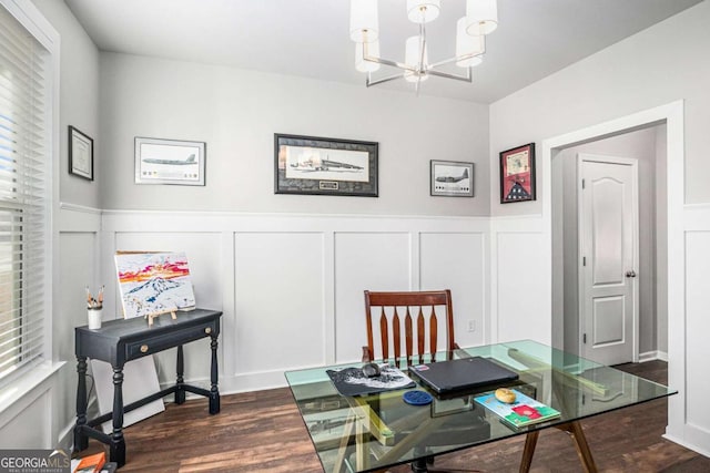 office area with a wainscoted wall, a chandelier, dark wood finished floors, and a decorative wall