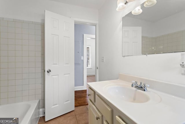 full bath featuring vanity and tile patterned floors