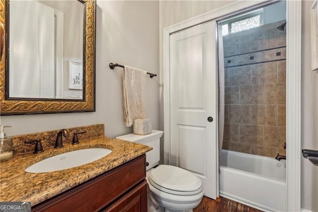 full bathroom featuring vanity, toilet, and shower / bathtub combination