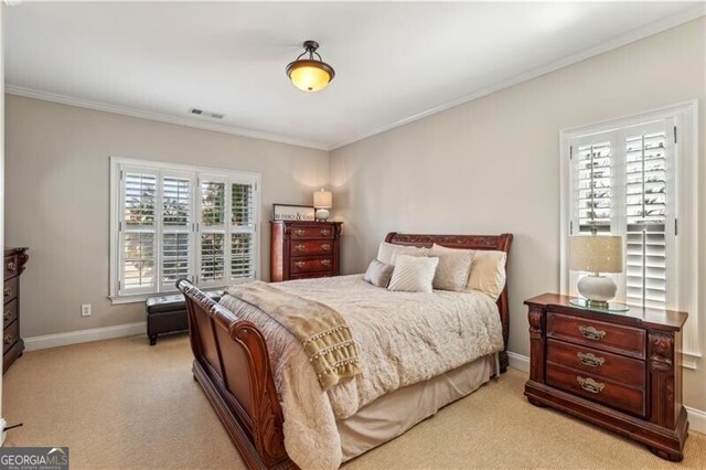 bedroom featuring ornamental molding, visible vents, light carpet, and baseboards