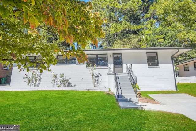 ranch-style house with crawl space, brick siding, a front lawn, and stairs