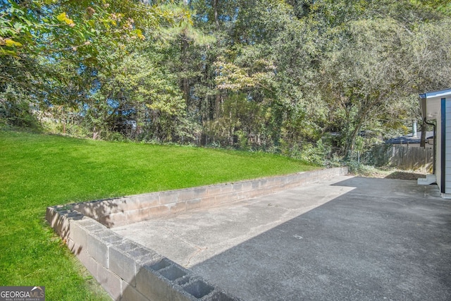 view of yard featuring a patio area and fence