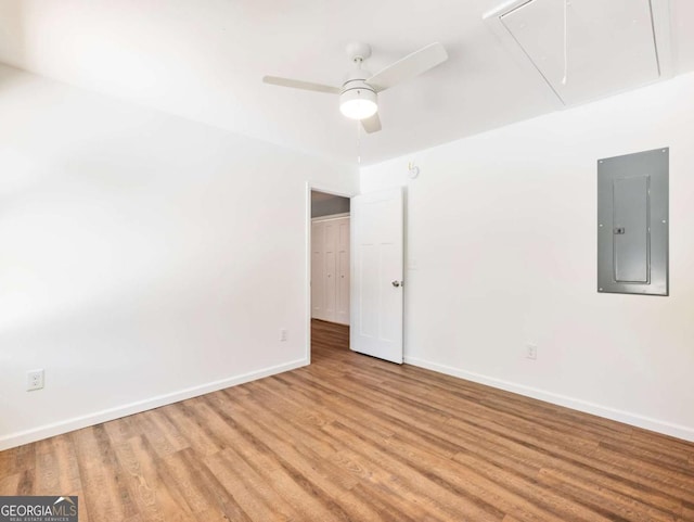 8087 Beachwood Dr, Murrayville, GA 30564 - empty room with attic access, electric panel, baseboards, ceiling fan, and wood finished floors