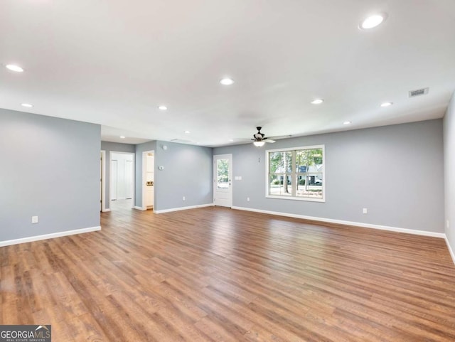 8087 Beachwood Dr, Murrayville, GA 30564 - unfurnished living room featuring light wood-type flooring, baseboards, visible vents, and recessed lighting