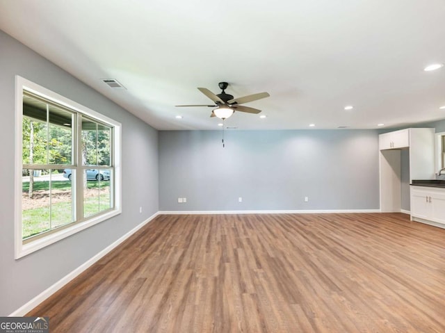 8087 Beachwood Dr, Murrayville, GA 30564 - unfurnished living room featuring light wood-style floors, visible vents, and baseboards