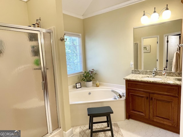 bathroom with lofted ceiling, a stall shower, a garden tub, and vanity