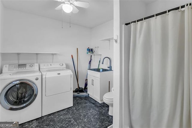 laundry area featuring laundry area, separate washer and dryer, a sink, and a ceiling fan