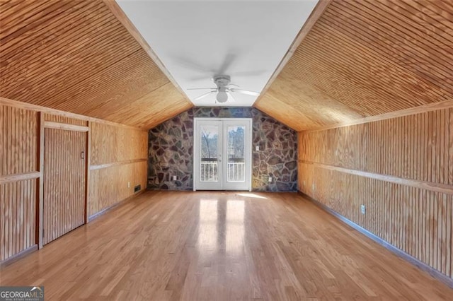 bonus room featuring wood ceiling, vaulted ceiling, wood walls, and wood finished floors