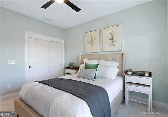 bedroom featuring a closet, carpet, visible vents, and baseboards