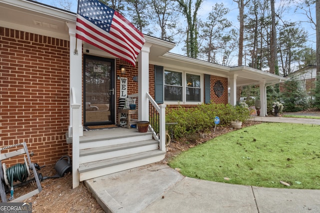 property entrance with brick siding