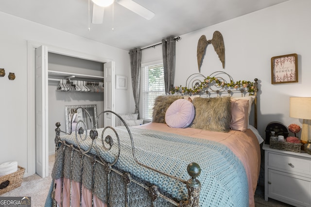 carpeted bedroom with a closet and ceiling fan