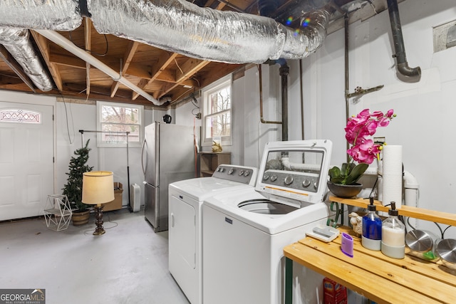 laundry area with separate washer and dryer