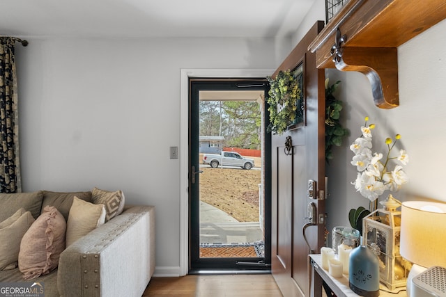 doorway featuring wood finished floors