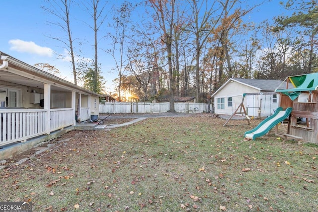 view of yard featuring a fenced backyard and a playground