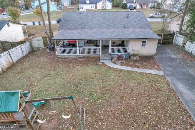 view of front of home with a porch and a fenced backyard