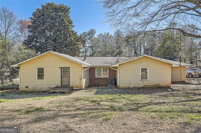 ranch-style house with brick siding and a front lawn