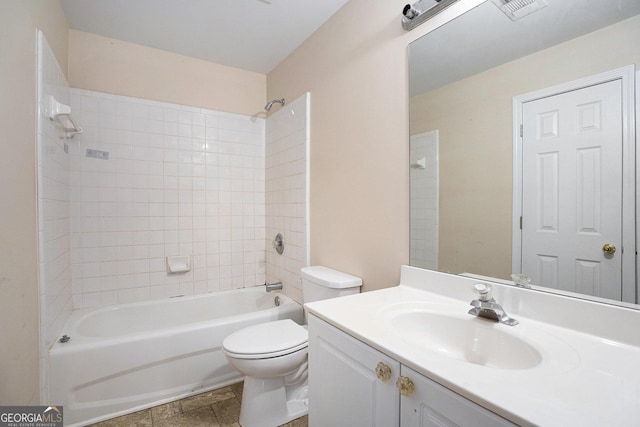 bathroom with visible vents, shower / tub combination, vanity, and toilet