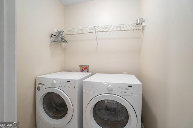 washroom with laundry area and washing machine and clothes dryer