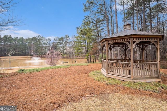 view of yard with a water view and a gazebo