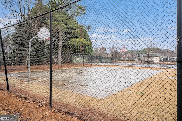 view of sport court featuring community basketball court and fence