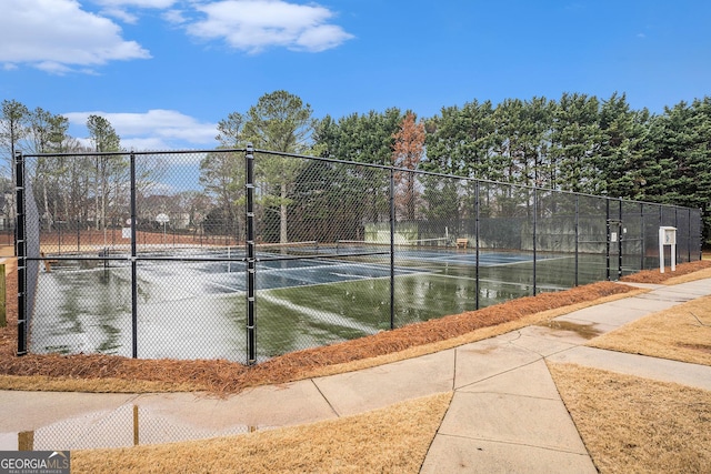 view of sport court with fence