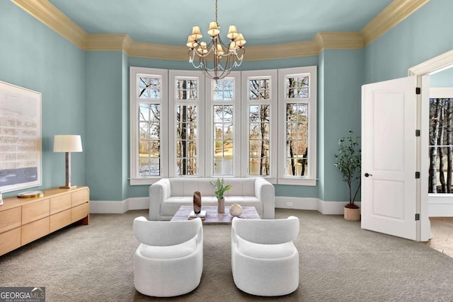 sitting room featuring a notable chandelier, carpet flooring, and crown molding